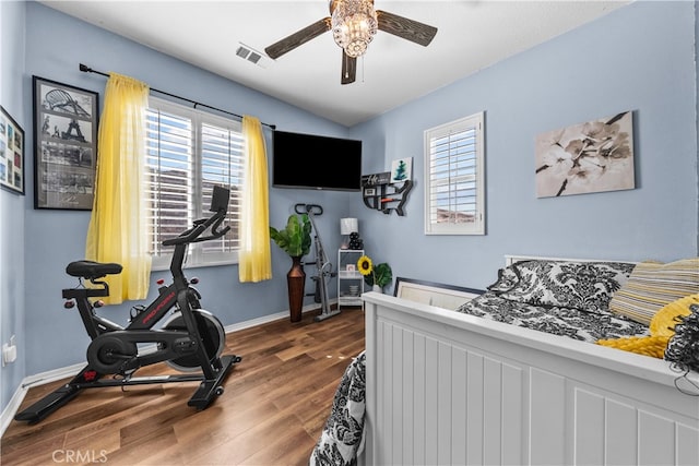 bedroom with lofted ceiling, dark wood-type flooring, and ceiling fan