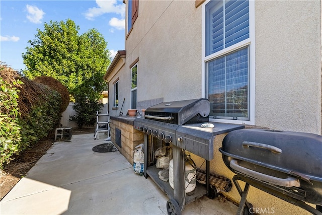 view of patio with a grill