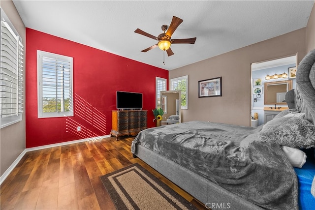 bedroom featuring a textured ceiling, hardwood / wood-style flooring, and ceiling fan