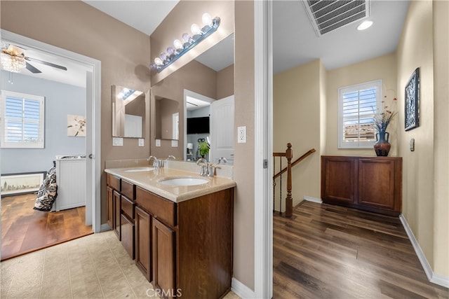 bathroom with vanity, ceiling fan, and hardwood / wood-style flooring