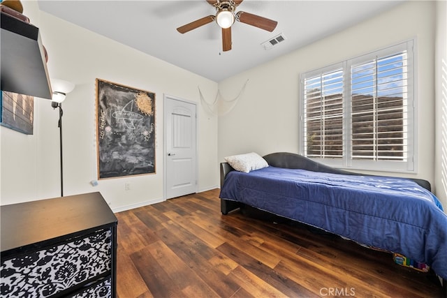 bedroom featuring ceiling fan and dark hardwood / wood-style flooring