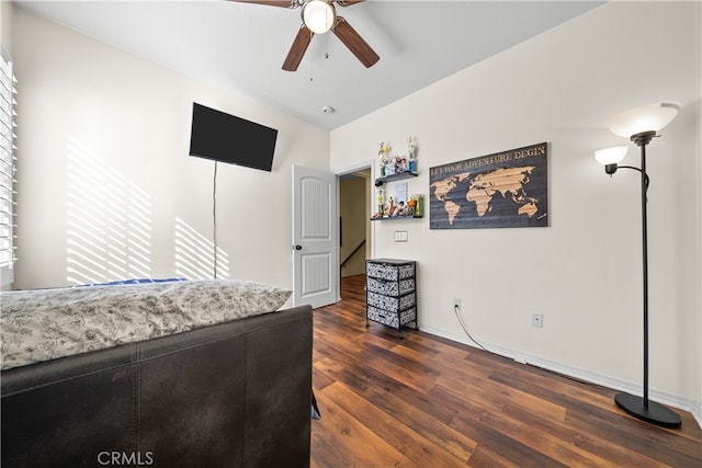 bedroom with lofted ceiling, dark wood-type flooring, and ceiling fan