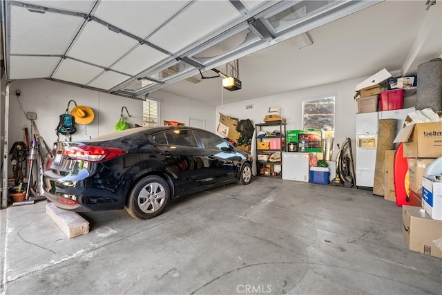 garage featuring a garage door opener