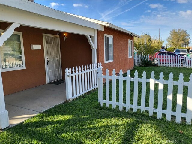 view of property exterior featuring a yard