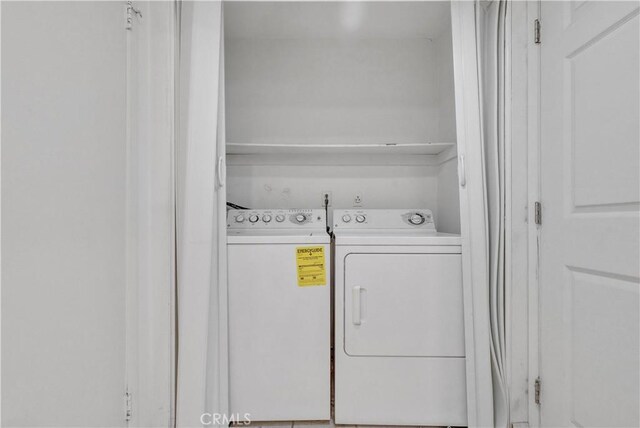 laundry room featuring washing machine and dryer