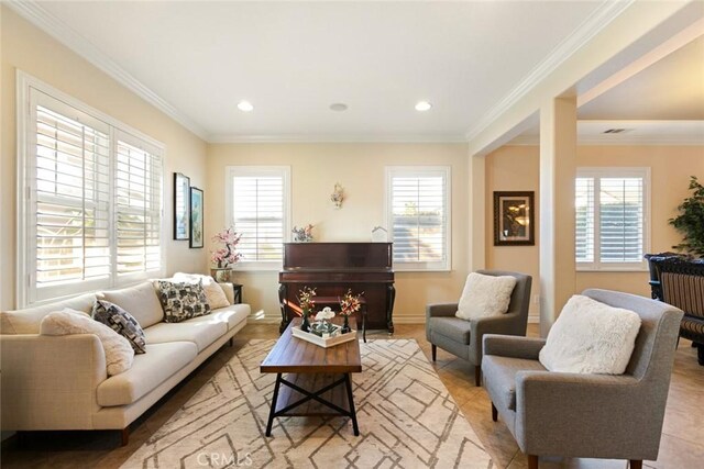 tiled living room featuring ornamental molding and a healthy amount of sunlight