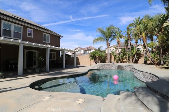 view of swimming pool featuring a fenced in pool, a patio area, and a fenced backyard