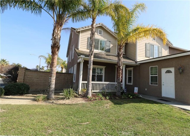 front of property with a porch and a front yard