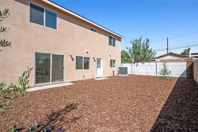 back of property with central air condition unit