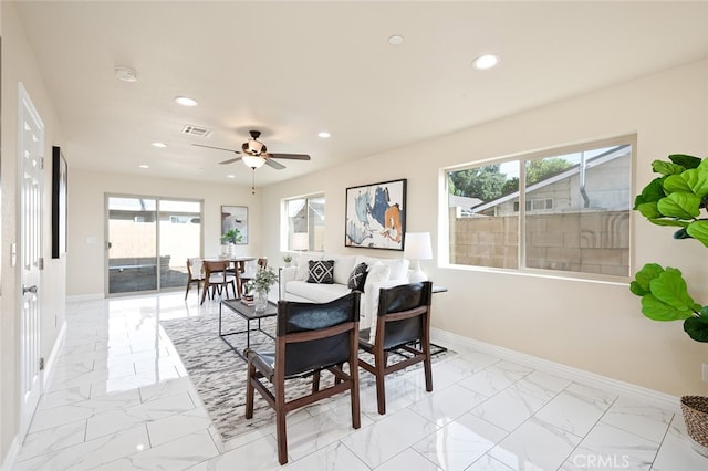 dining area featuring ceiling fan and a wealth of natural light