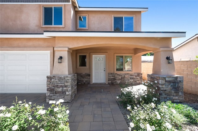 entrance to property featuring a garage