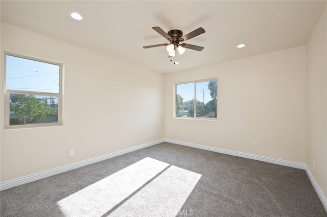 carpeted empty room featuring ceiling fan