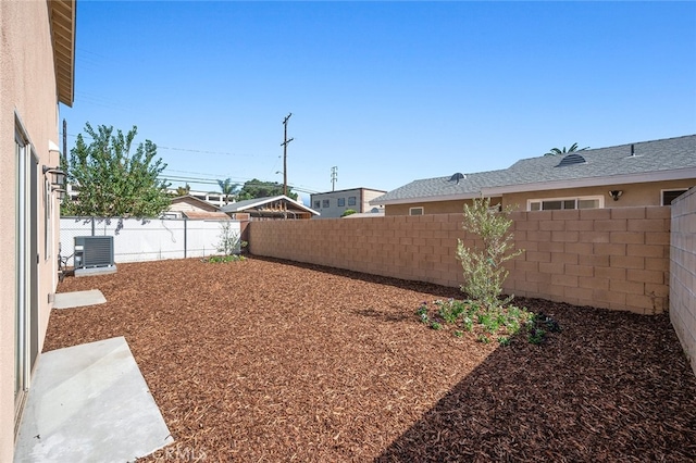 view of yard with central AC unit