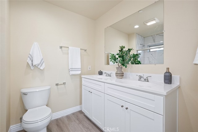 bathroom with vanity, toilet, wood-type flooring, and an enclosed shower