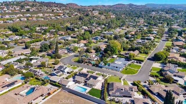 birds eye view of property featuring a mountain view