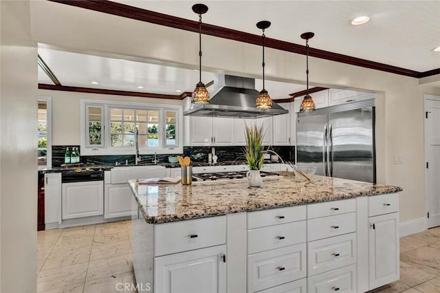 kitchen featuring exhaust hood, a center island with sink, stainless steel built in fridge, hanging light fixtures, and white cabinetry