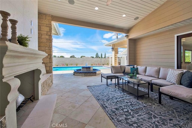 view of patio with outdoor lounge area and a fenced in pool