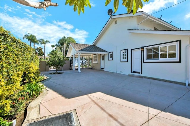 rear view of property with a patio area