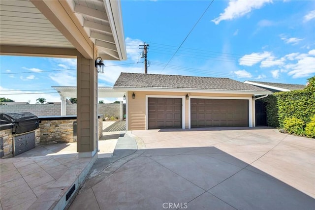 view of front of property featuring an outbuilding and a garage