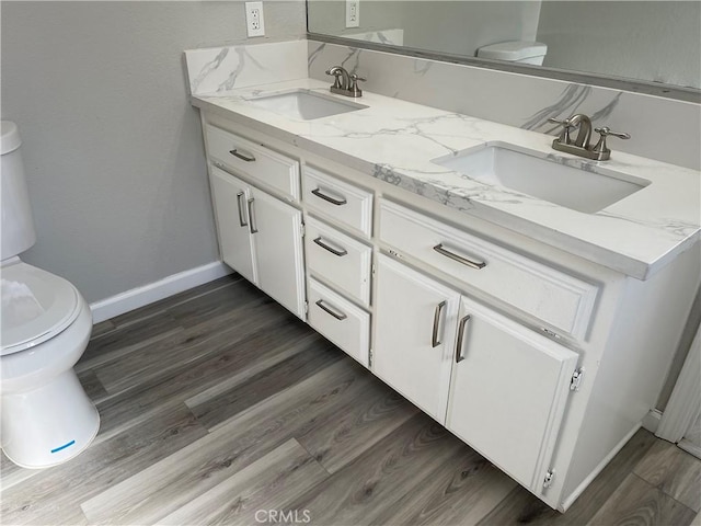 13165 Caspian Dr, Victorville, CA 92395 - bathroom featuring toilet, a sink, and double vanity