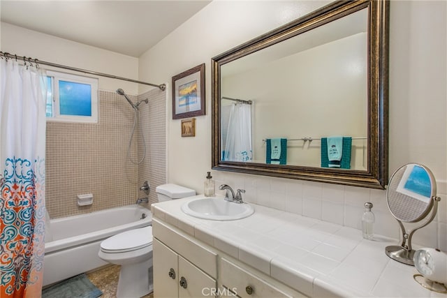 full bathroom featuring vanity, toilet, tasteful backsplash, and shower / bath combo with shower curtain