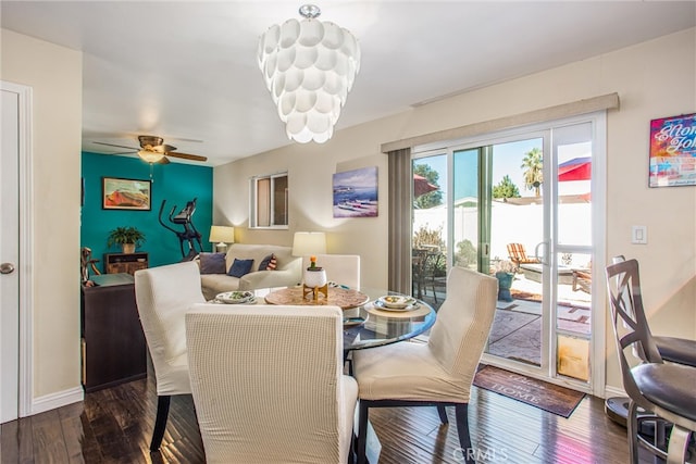 dining area featuring ceiling fan and dark hardwood / wood-style flooring