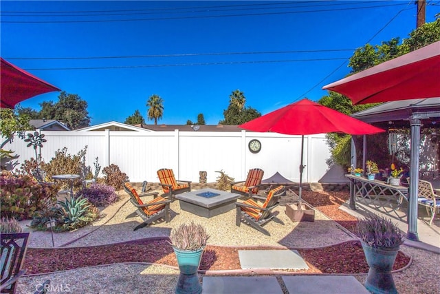 view of yard with a patio and a fire pit