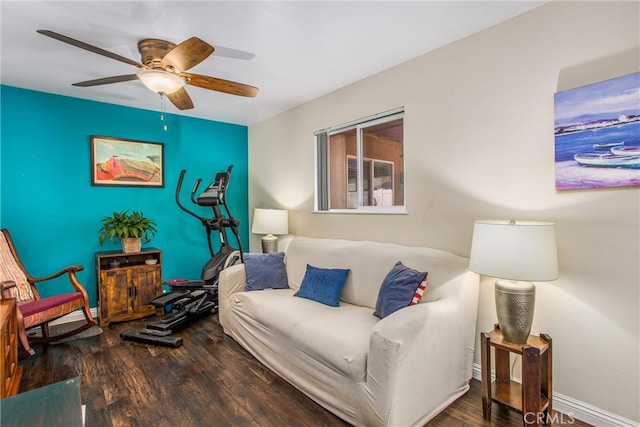 living room featuring ceiling fan and hardwood / wood-style floors