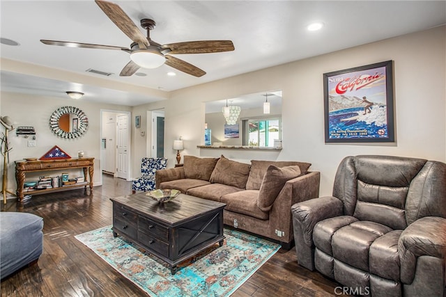 living room with dark hardwood / wood-style floors and ceiling fan