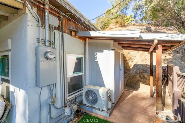 view of side of property with ac unit