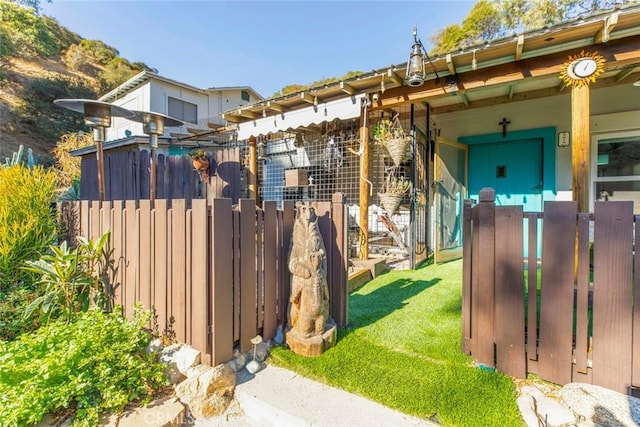 exterior space with a yard and fence