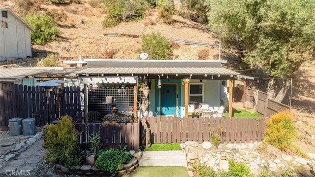 view of front of house with fence and stucco siding