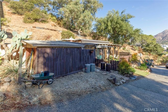 view of outbuilding with a mountain view