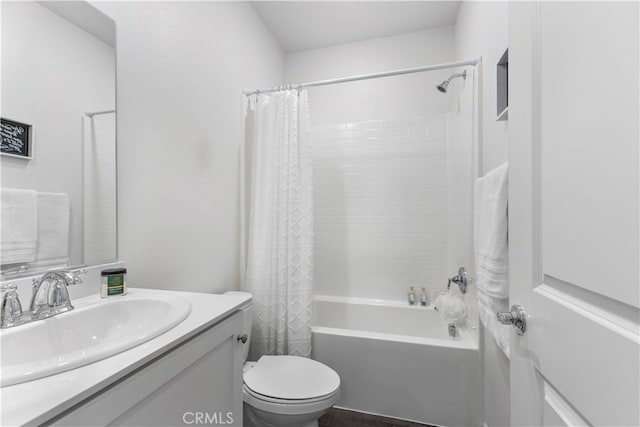 full bathroom with vanity, shower / bathtub combination with curtain, and toilet