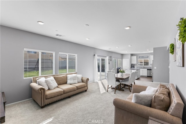 living room featuring light colored carpet