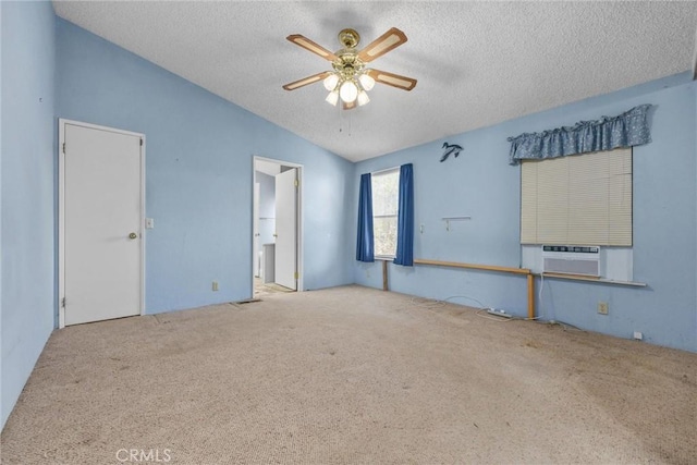 carpeted spare room with lofted ceiling, ceiling fan, a textured ceiling, and cooling unit