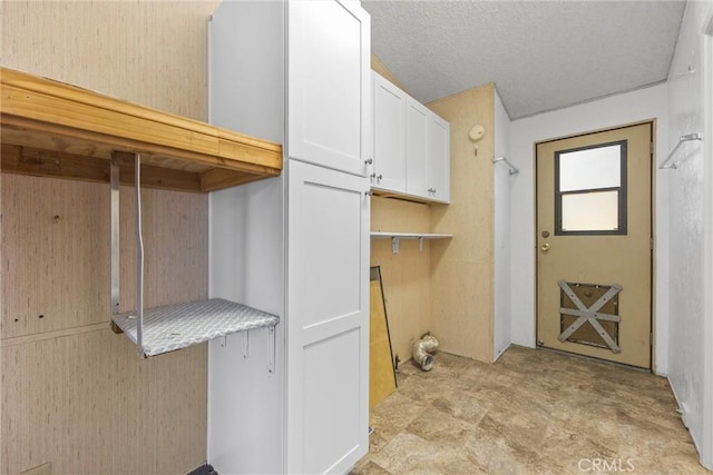 washroom with a textured ceiling