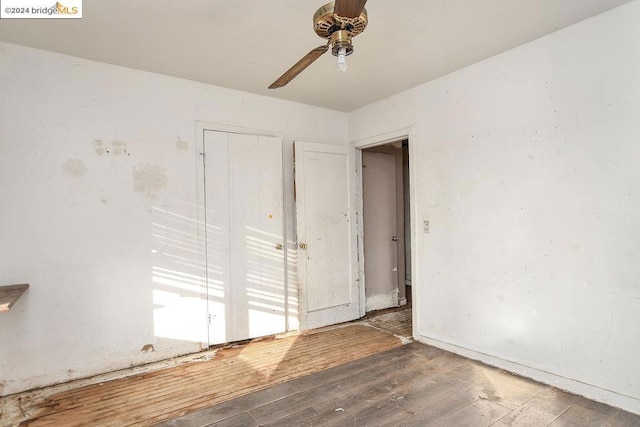 spare room with ceiling fan and dark hardwood / wood-style floors