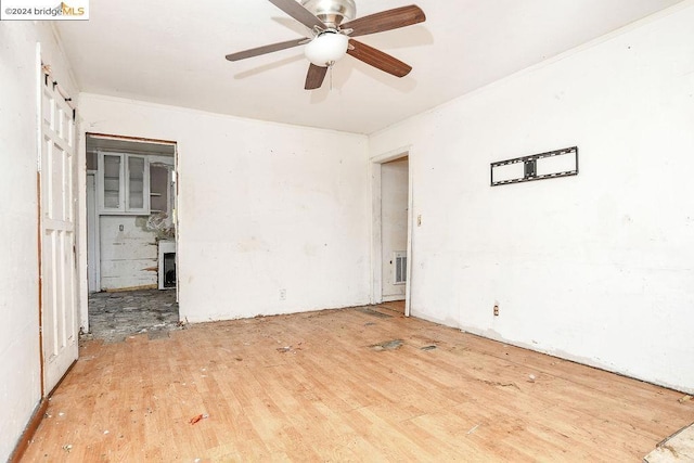 spare room featuring hardwood / wood-style floors and ceiling fan