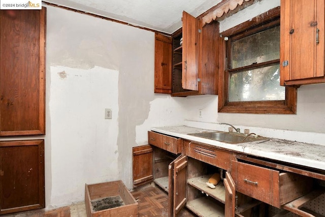 kitchen with dark parquet flooring and sink