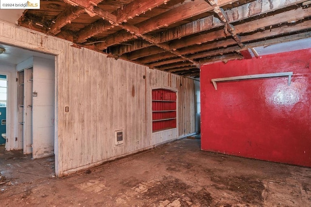 miscellaneous room with wooden walls