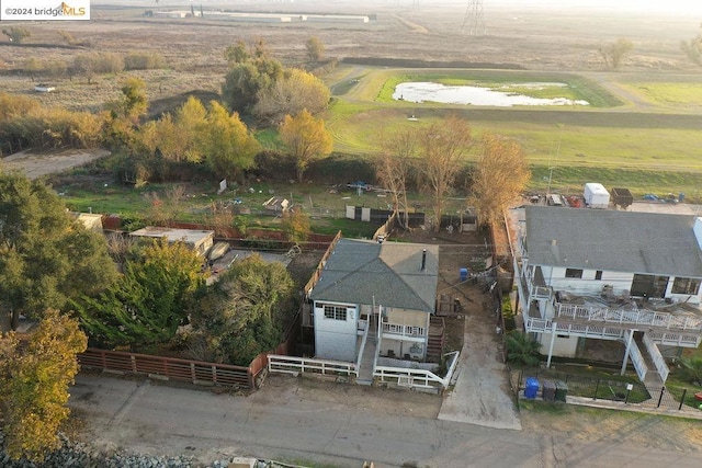 birds eye view of property with a rural view