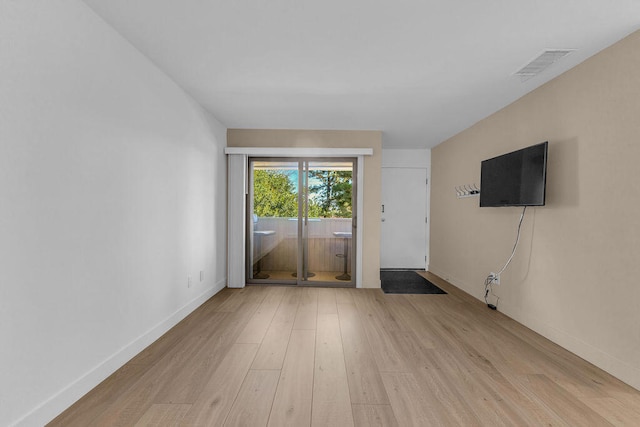 empty room with light wood-type flooring