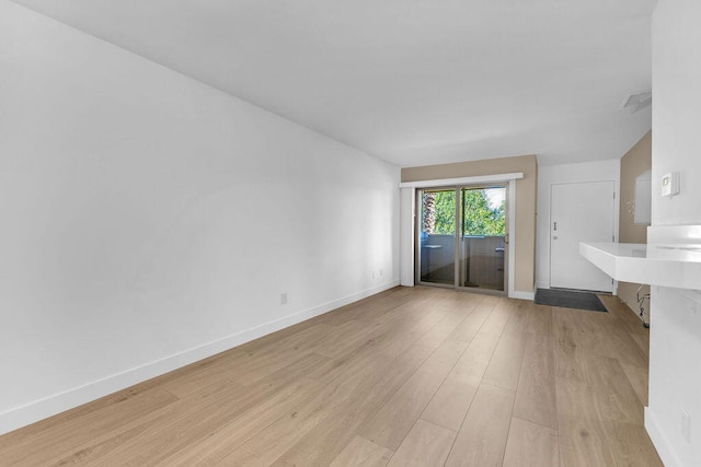 unfurnished living room featuring light hardwood / wood-style flooring