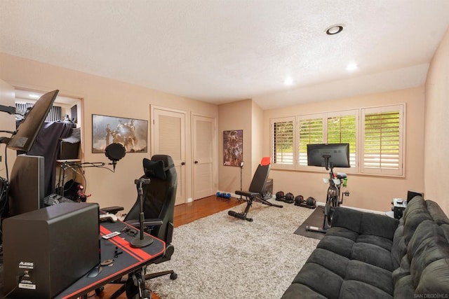 workout room with hardwood / wood-style floors