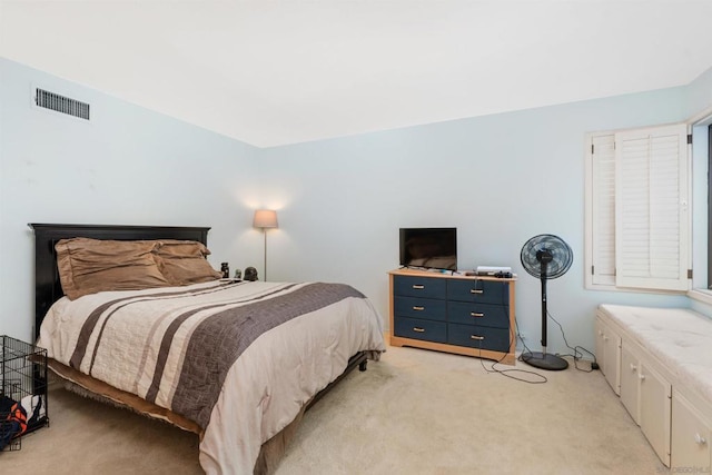 bedroom with light colored carpet