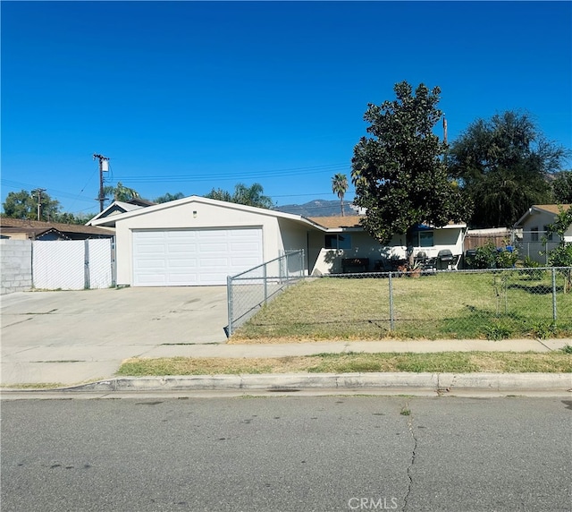 ranch-style house with a front yard and a garage