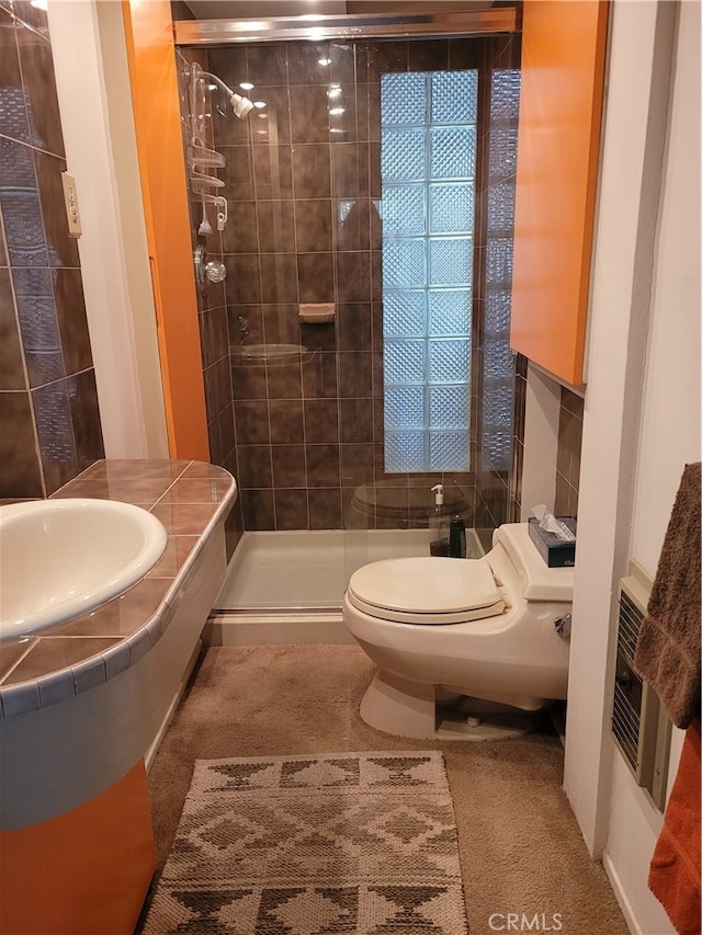 bathroom with vanity, toilet, and an enclosed shower