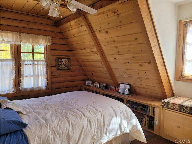 bedroom with vaulted ceiling with beams, wood ceiling, rustic walls, and ceiling fan