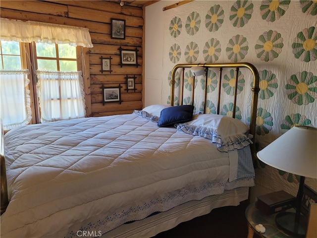 bedroom featuring rustic walls